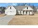 Two-story home with attached garage and manicured lawn at 43 Harmony Woods Dr, Dallas, GA 30157