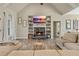 Living room with stone fireplace, built-in shelving, and hardwood floors at 43 Harmony Woods Dr, Dallas, GA 30157