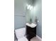 Small bathroom with toilet and dark vanity at 1559 Walker Ave, College Park, GA 30337