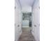 Long hallway bathroom with double doors and tile floors at 1559 Walker Ave, College Park, GA 30337