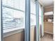 Bright bedroom featuring window with light blue curtains at 1559 Walker Ave, College Park, GA 30337