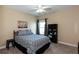 Bedroom with a double bed, ceiling fan, and a bookcase at 1559 Walker Ave, College Park, GA 30337