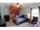 Cozy bedroom with a double bed, seating area, and built-in shelves at 1559 Walker Ave, College Park, GA 30337