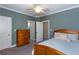 Bedroom with full bed, dresser and access to bathroom at 1559 Walker Ave, College Park, GA 30337