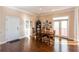 Charming dining room with hardwood floors and access to a balcony at 1559 Walker Ave, College Park, GA 30337