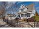 Two-story craftsman home with gray siding, brick accents, and a charming front porch at 1559 Walker Ave, College Park, GA 30337