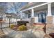 Inviting front porch with brick columns, a ceiling fan, and comfortable seating at 1559 Walker Ave, College Park, GA 30337