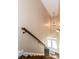 Elegant staircase with wood railing leading to the upper level at 1559 Walker Ave, College Park, GA 30337