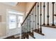 Elegant staircase with dark wood and wrought iron railing at 1559 Walker Ave, College Park, GA 30337