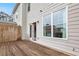 Exterior view of backyard deck, siding, and door leading inside the house at 1716 Prelude, Marietta, GA 30067