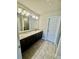 Double vanity bathroom with granite countertops and tile floors at 1716 Prelude, Marietta, GA 30067