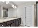 Bathroom with double sink vanity, granite countertops, tile flooring, and glass shower at 1716 Prelude, Marietta, GA 30067