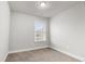 Neutral bedroom featuring plush carpet, lots of light, and neutral wall color at 1716 Prelude, Marietta, GA 30067