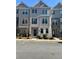 Two-story townhome with neutral siding and landscaping at 1716 Prelude, Marietta, GA 30067