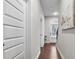 Inviting hallway with hardwood floors leads to the bright front door and stairs at 1716 Prelude, Marietta, GA 30067