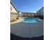 Community pool with clear water, concrete surround, and townhomes in the background at 1716 Prelude, Marietta, GA 30067