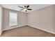 Bedroom with carpet and ceiling fan at 1855 Charleston Oak Cir, Lawrenceville, GA 30043