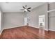 Hardwood floor bedroom with high ceilings and a ceiling fan at 1855 Charleston Oak Cir, Lawrenceville, GA 30043