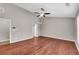 Bright bedroom featuring hardwood floors and a ceiling fan at 1855 Charleston Oak Cir, Lawrenceville, GA 30043