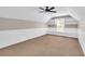 Spacious bonus room with window and built-in shelving at 1855 Charleston Oak Cir, Lawrenceville, GA 30043