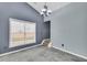 Spacious dining area with large window and tile floor at 1855 Charleston Oak Cir, Lawrenceville, GA 30043