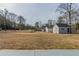 Expansive backyard with a storage shed, ideal for gardening or recreational use at 1890 Old Concord Se Dr, Covington, GA 30016