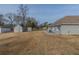 Large backyard featuring well maintained lawn, storage shed, and ample space for outdoor enjoyment at 1890 Old Concord Se Dr, Covington, GA 30016