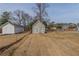 View of the backyard featuring storage building with easy access to the rest of the yard at 1890 Old Concord Se Dr, Covington, GA 30016