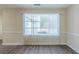 Dining Room with wood flooring, large window, and neutral paint throughout at 1890 Old Concord Se Dr, Covington, GA 30016