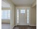 Bright entryway featuring a white front door with decorative glass and hardwood floors at 1890 Old Concord Se Dr, Covington, GA 30016