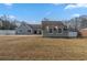 Charming single story home with light gray siding and a large front yard at 1890 Old Concord Se Dr, Covington, GA 30016