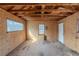 Interior view of shed construction, featuring plywood walls and ceiling at 1890 Old Concord Se Dr, Covington, GA 30016