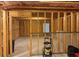 Unfinished basement with framed walls and exposed insulation at 5615 Cowles Cir, Suwanee, GA 30024