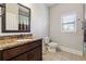 Bathroom with granite countertop and tiled floors at 5615 Cowles Cir, Suwanee, GA 30024