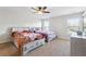 Spacious bedroom with two twin beds and ample natural light at 5615 Cowles Cir, Suwanee, GA 30024