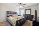 Spacious bedroom with a dresser and ceiling fan at 5615 Cowles Cir, Suwanee, GA 30024