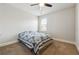 Bright bedroom with carpeted floors and a comfortable bed at 5615 Cowles Cir, Suwanee, GA 30024