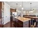 Spacious kitchen with an island, stainless steel appliances, and dark wood cabinets at 5615 Cowles Cir, Suwanee, GA 30024