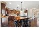 Spacious kitchen with an island, stainless steel appliances, and dark wood cabinets at 5615 Cowles Cir, Suwanee, GA 30024