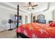 Large main bedroom with a post bed and en-suite bathroom at 5615 Cowles Cir, Suwanee, GA 30024