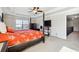 Main bedroom with a king-size bed and access to a loft at 5615 Cowles Cir, Suwanee, GA 30024