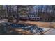 House with long driveway, surrounded by trees at 95 Twin Lakes Dr, Carrollton, GA 30116