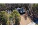 Home surrounded by tall trees, showcasing large yard at 95 Twin Lakes Dr, Carrollton, GA 30116