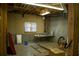 Unfinished basement with concrete floor and window at 95 Twin Lakes Dr, Carrollton, GA 30116