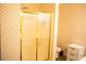 Bathroom with shower and patterned wallpaper at 95 Twin Lakes Dr, Carrollton, GA 30116