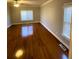 Bright bedroom with hardwood floors and ceiling fan at 95 Twin Lakes Dr, Carrollton, GA 30116