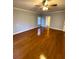 Spacious bedroom with hardwood floors and a ceiling fan at 95 Twin Lakes Dr, Carrollton, GA 30116