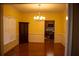 Spacious dining room with hardwood floors and a view of the kitchen at 95 Twin Lakes Dr, Carrollton, GA 30116