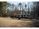 Ranch-style home with front porch and mature trees at 95 Twin Lakes Dr, Carrollton, GA 30116