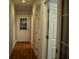 Hardwood floor hallway with several doors leading to other rooms at 95 Twin Lakes Dr, Carrollton, GA 30116